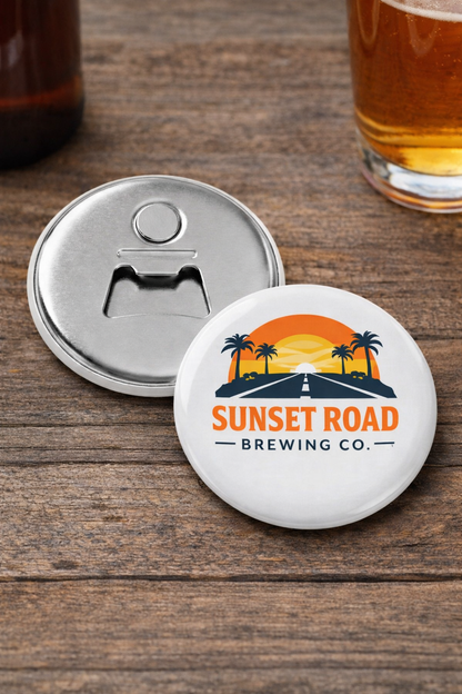 Coaster with bottle opener and 'Sunset Road Brewing Co.' logo on a wooden surface with a glass of beer.