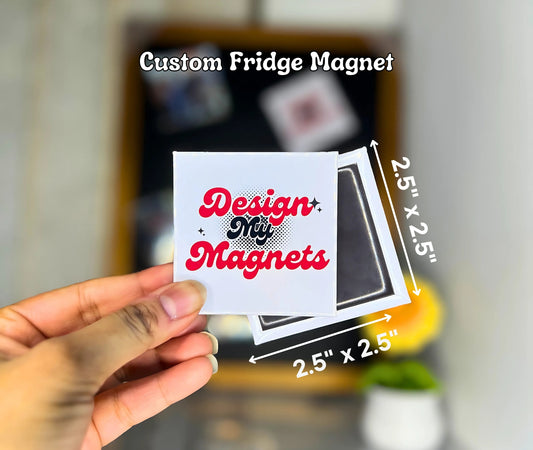 A hand holding a custom fridge magnet with the "Design My Magnets" logo, showcasing labeled dimensions in inches.