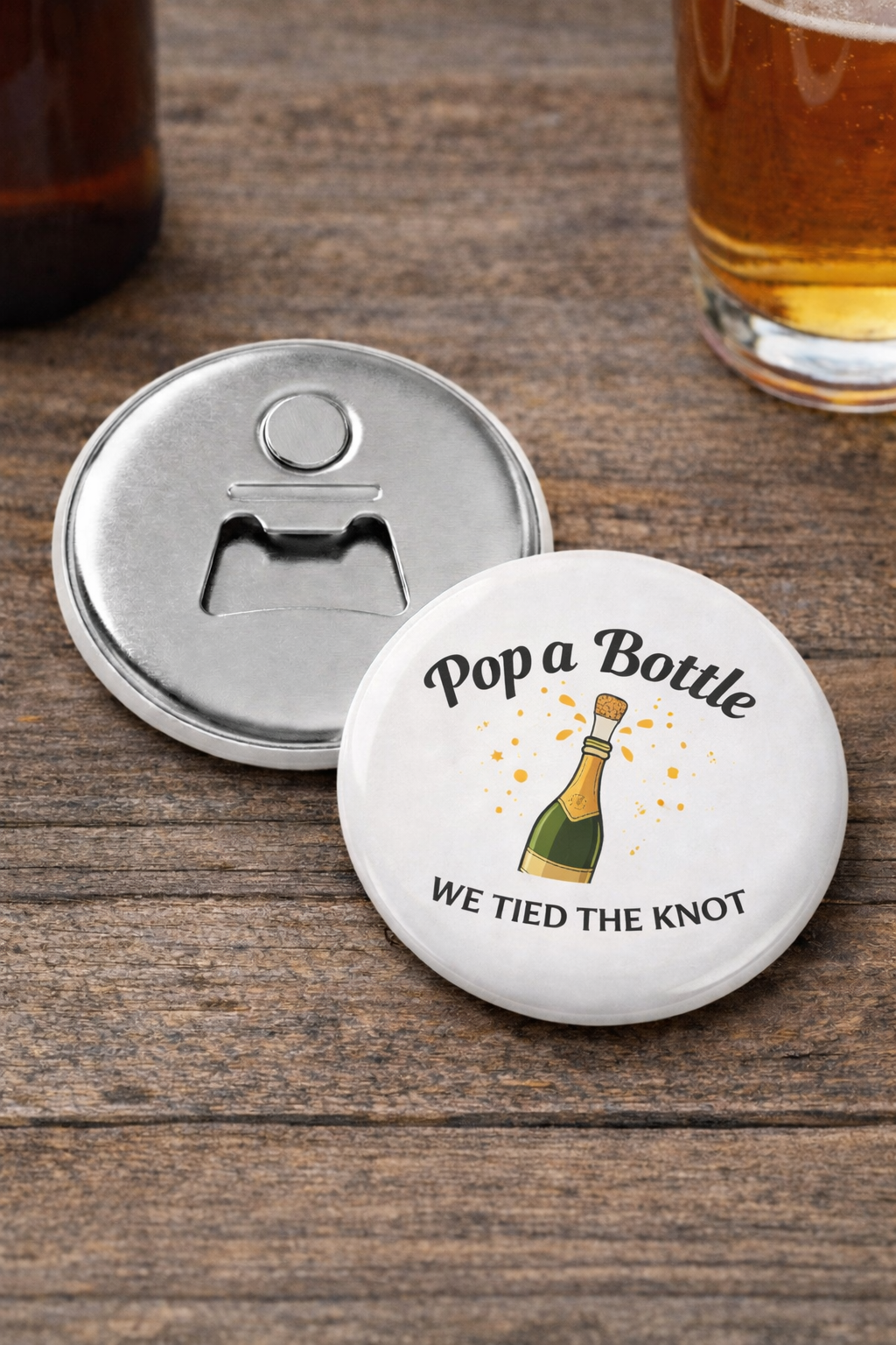 Bottle opener coaster with text 'Pop a Bottle We Tied the Knot' on a wooden surface with a glass of beer.